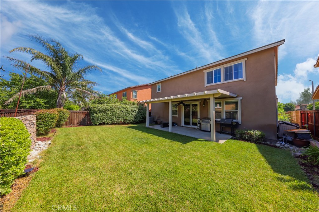 3848 Vine Maple Road San Bernardino, CA 92407 - Photo 22 of 25 a view of a house with swimming pool and sitting area