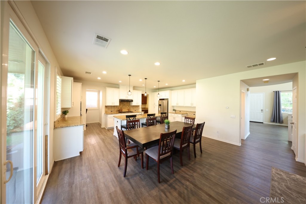 3848 Vine Maple Road San Bernardino, CA 92407 - Photo 4 of 25 a view of a dining room with furniture and wooden floor