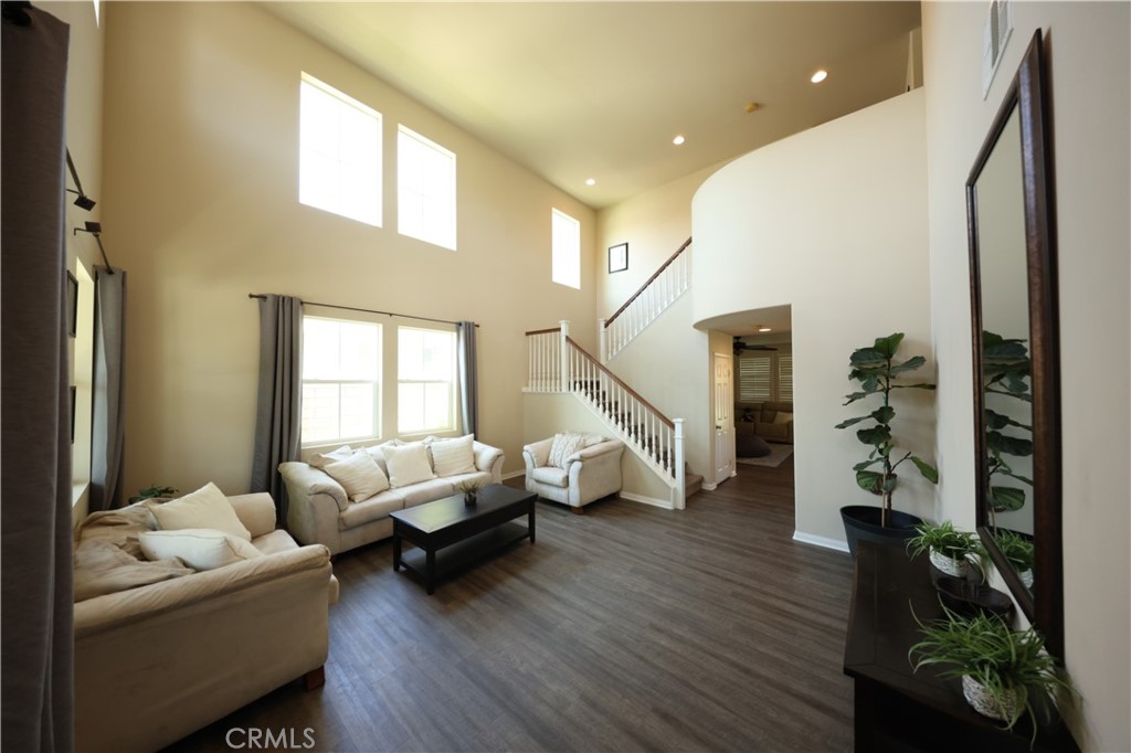 3848 Vine Maple Road San Bernardino, CA 92407 - Photo 6 of 25 a living room with furniture and wooden floor