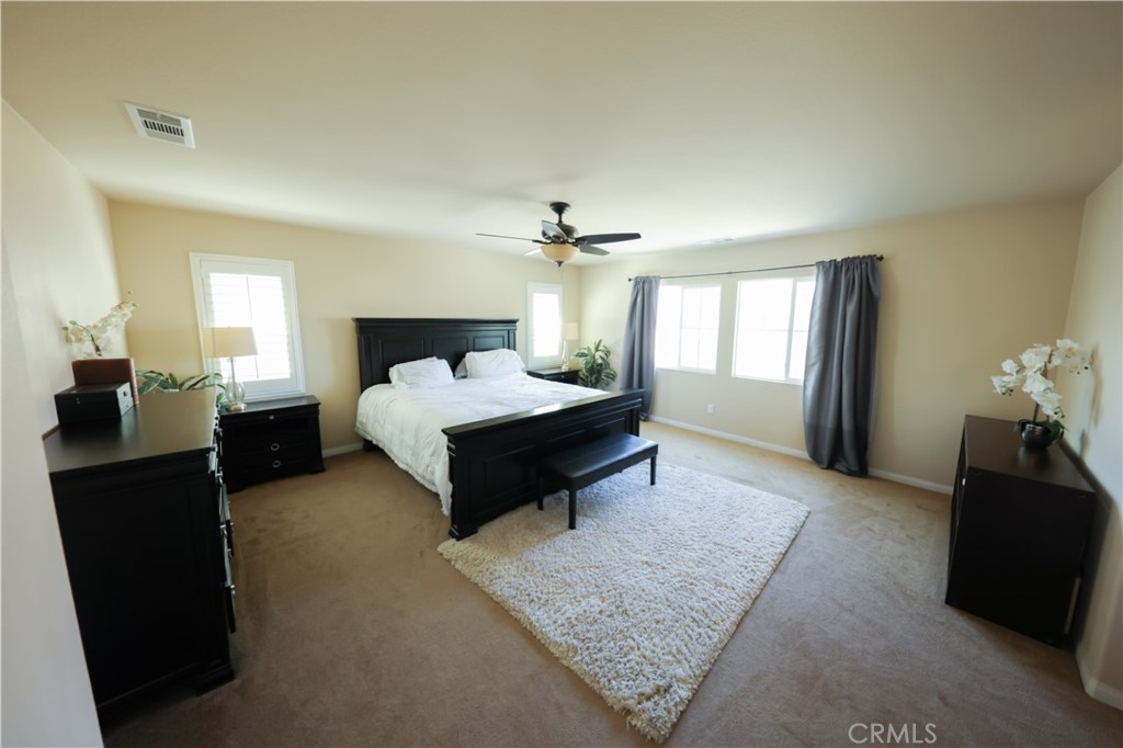 3848 Vine Maple Road San Bernardino, CA 92407 - Photo 10 of 25 a bedroom with a bed and window