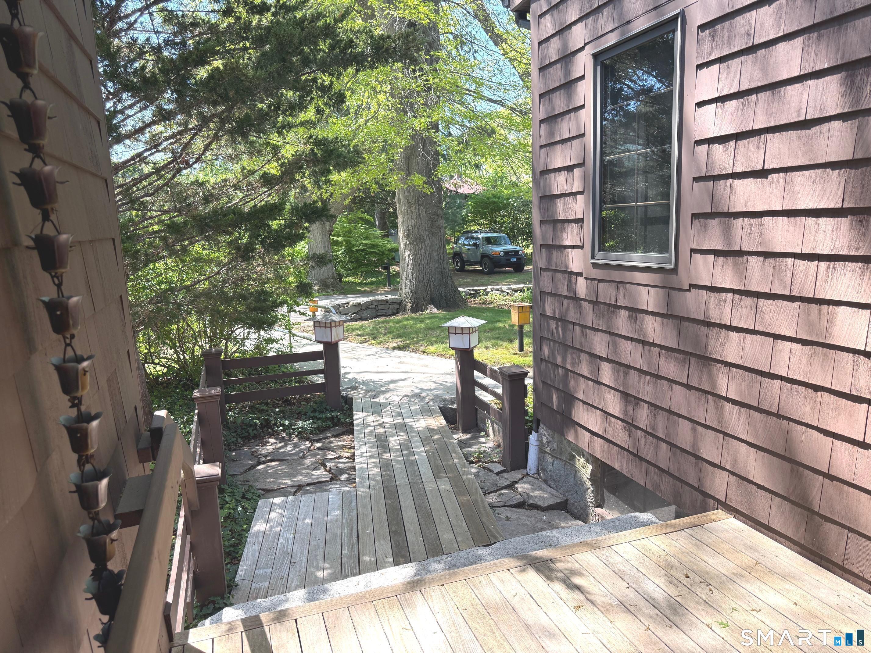 8 Ivy Road Stonington, CT 06355 - Photo 27 of 30 a view of a bench in the backyard