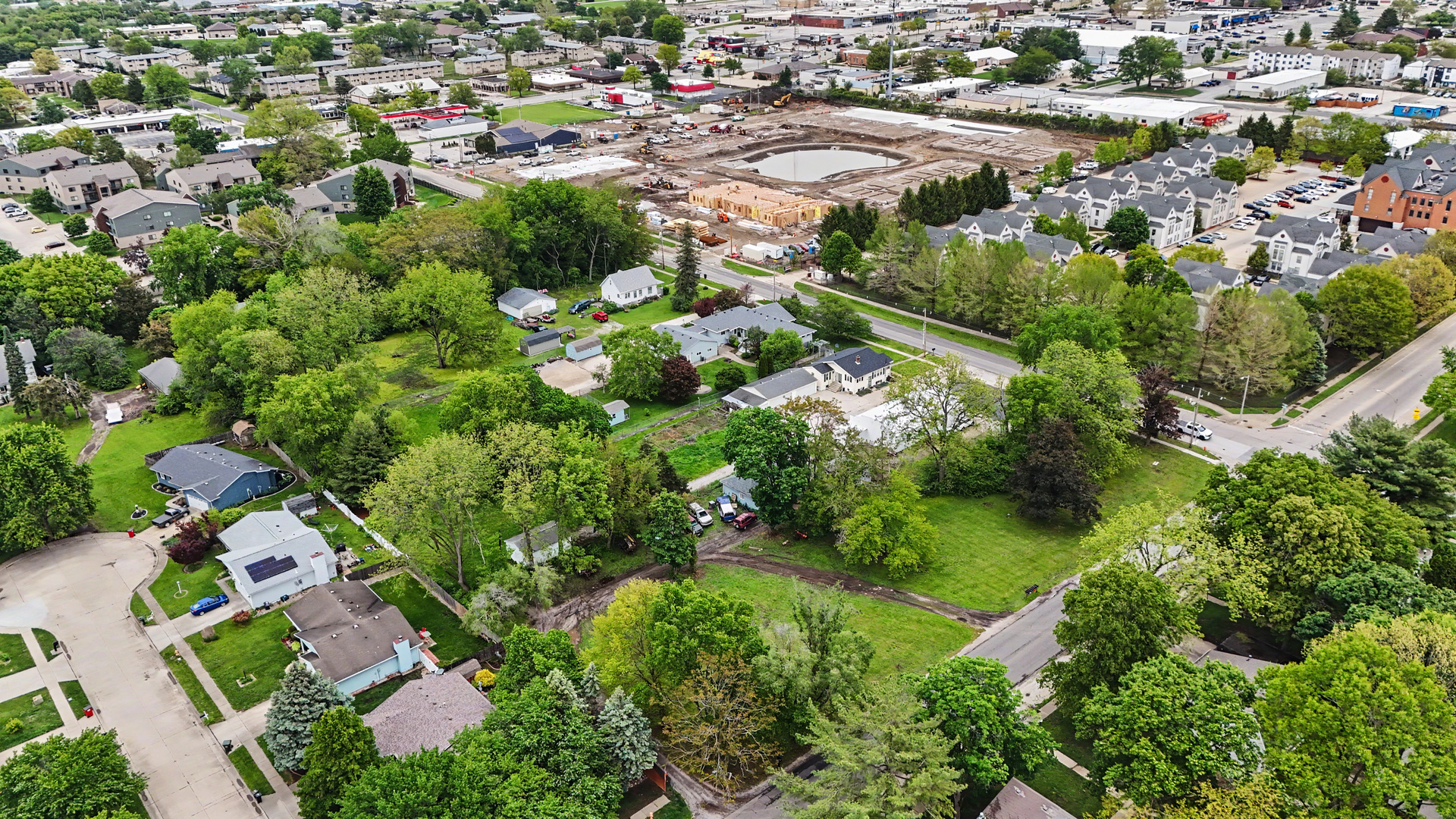 2404 West John Street Champaign, IL 61821 - Photo 13 of 24 an aerial view of residential houses with outdoor space and trees