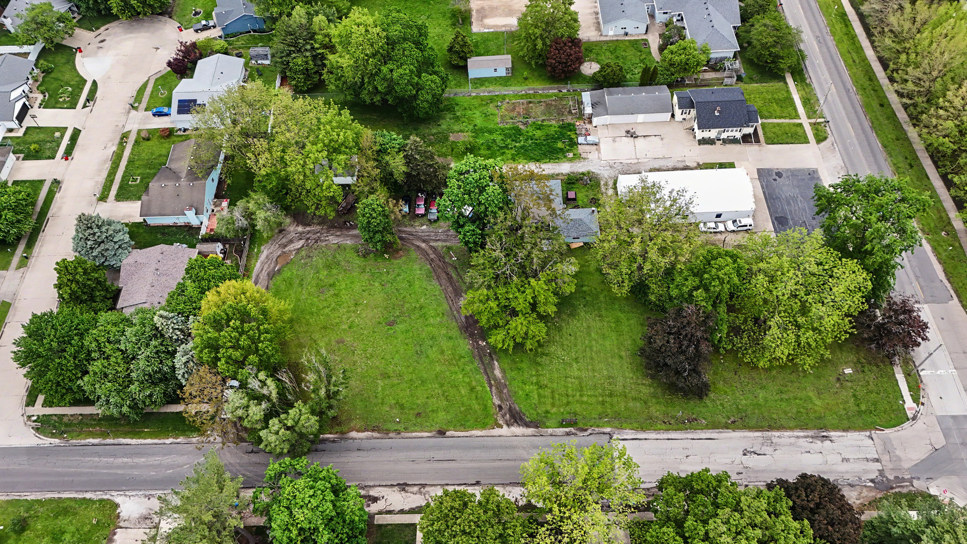 2404 West John Street Champaign, IL 61821 - Photo 14 of 24 an aerial view of residential house with outdoor space and trees all around