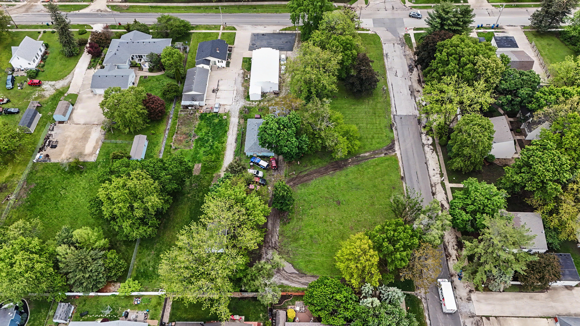 2404 West John Street Champaign, IL 61821 - Photo 20 of 24 an aerial view of residential house with outdoor space and trees all around