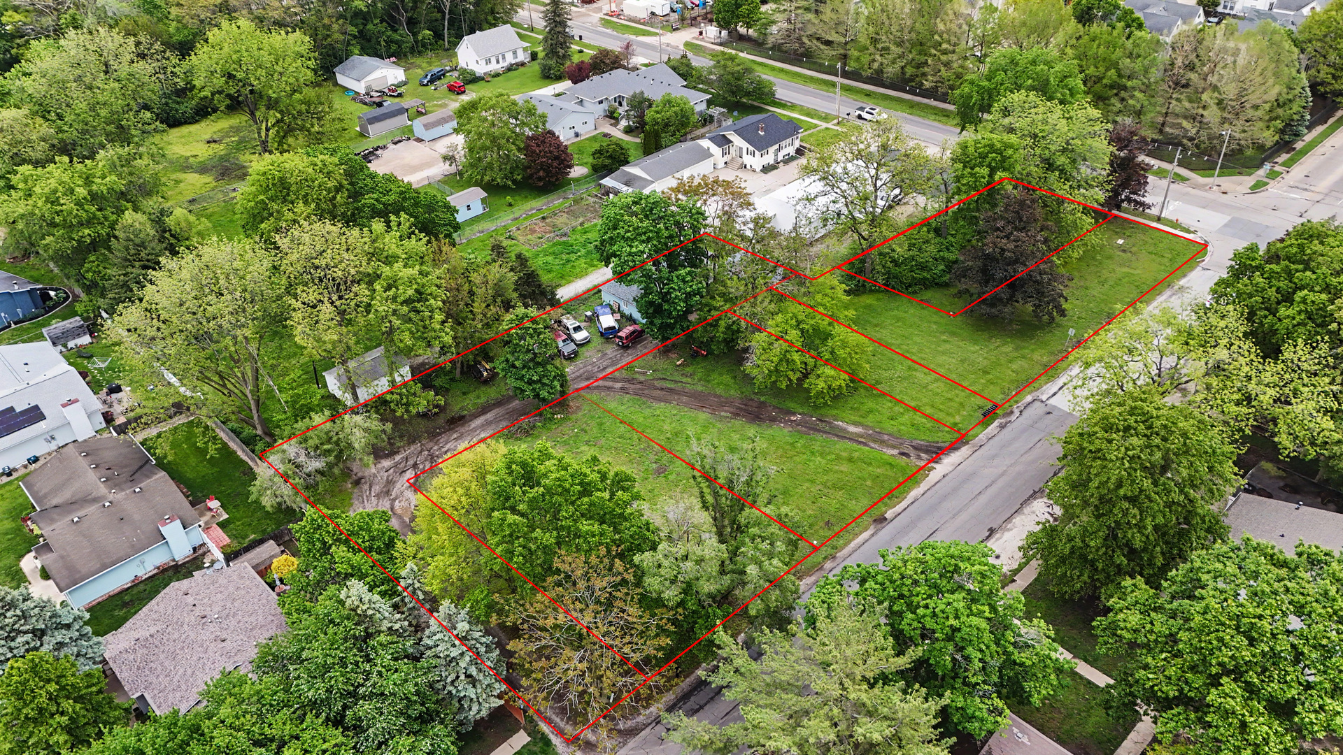 2404 West John Street Champaign, IL 61821 - Photo 8 of 24 an aerial view of a house with a yard