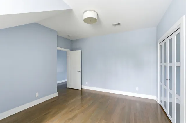 a view of an empty walk in closet