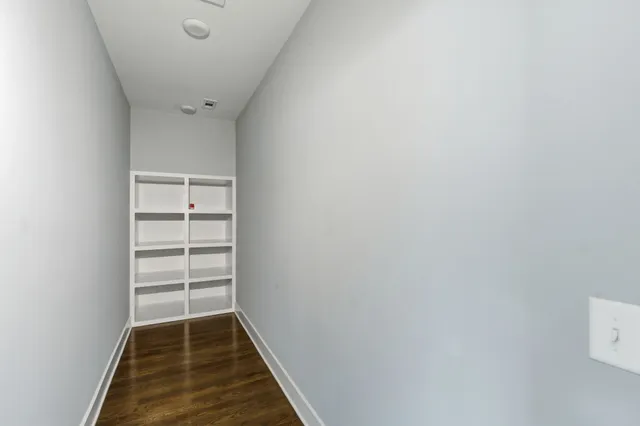 a bathroom with a granite countertop sink mirror and double