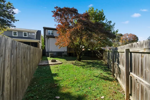 a view of a backyard with sitting area