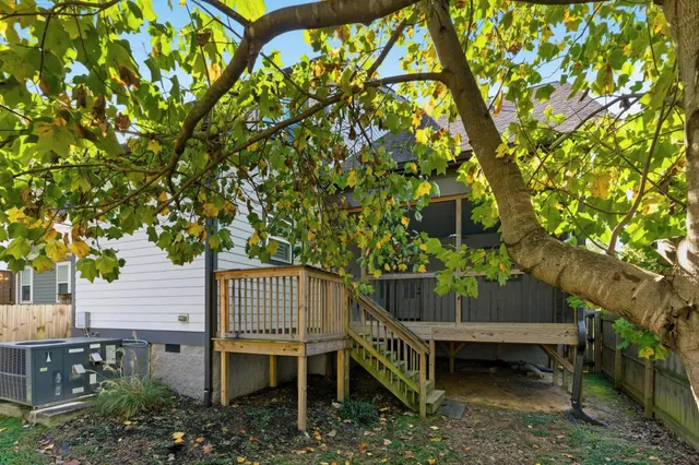 a front view of a house with plants