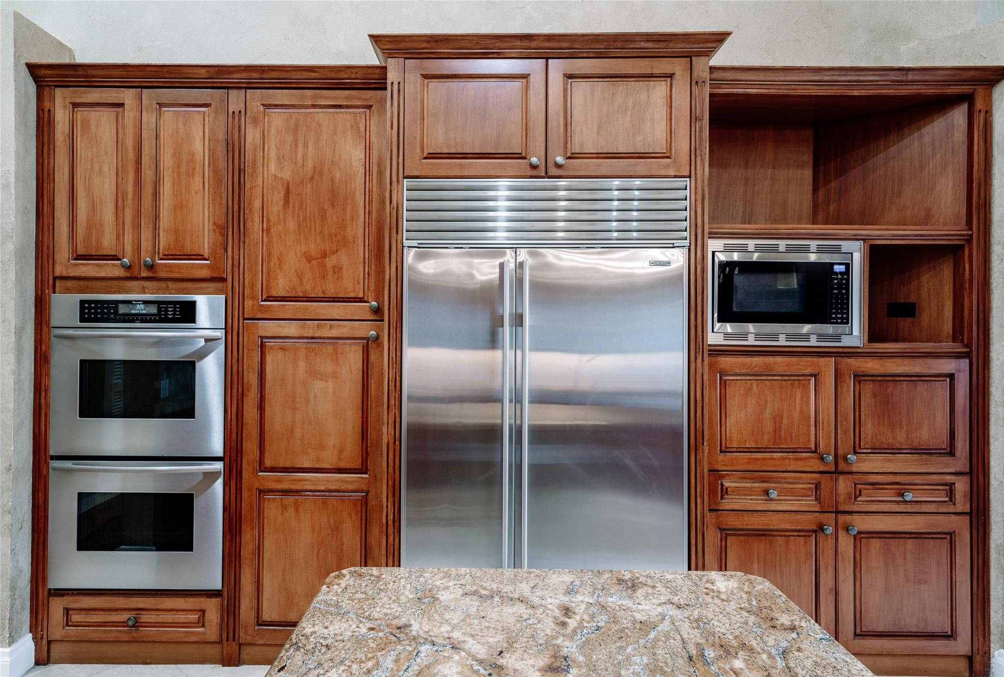 3220 Paddock Road Weston, FL 33331 - Photo 11 of 59 a kitchen with granite countertop stainless steel appliances and wooden cabinets