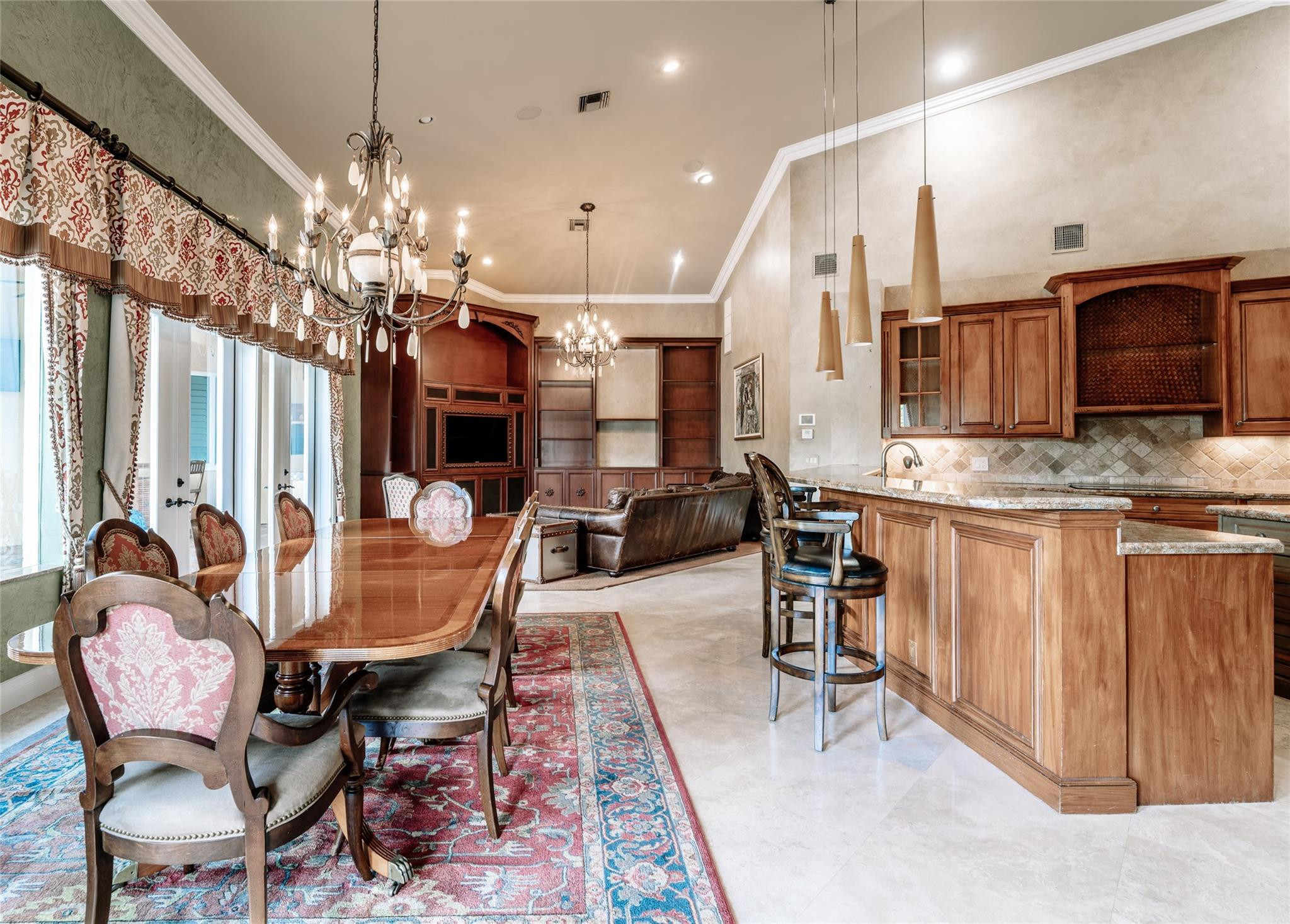 3220 Paddock Road Weston, FL 33331 - Photo 14 of 59 a view of a dining room with furniture a chandelier and wooden floor