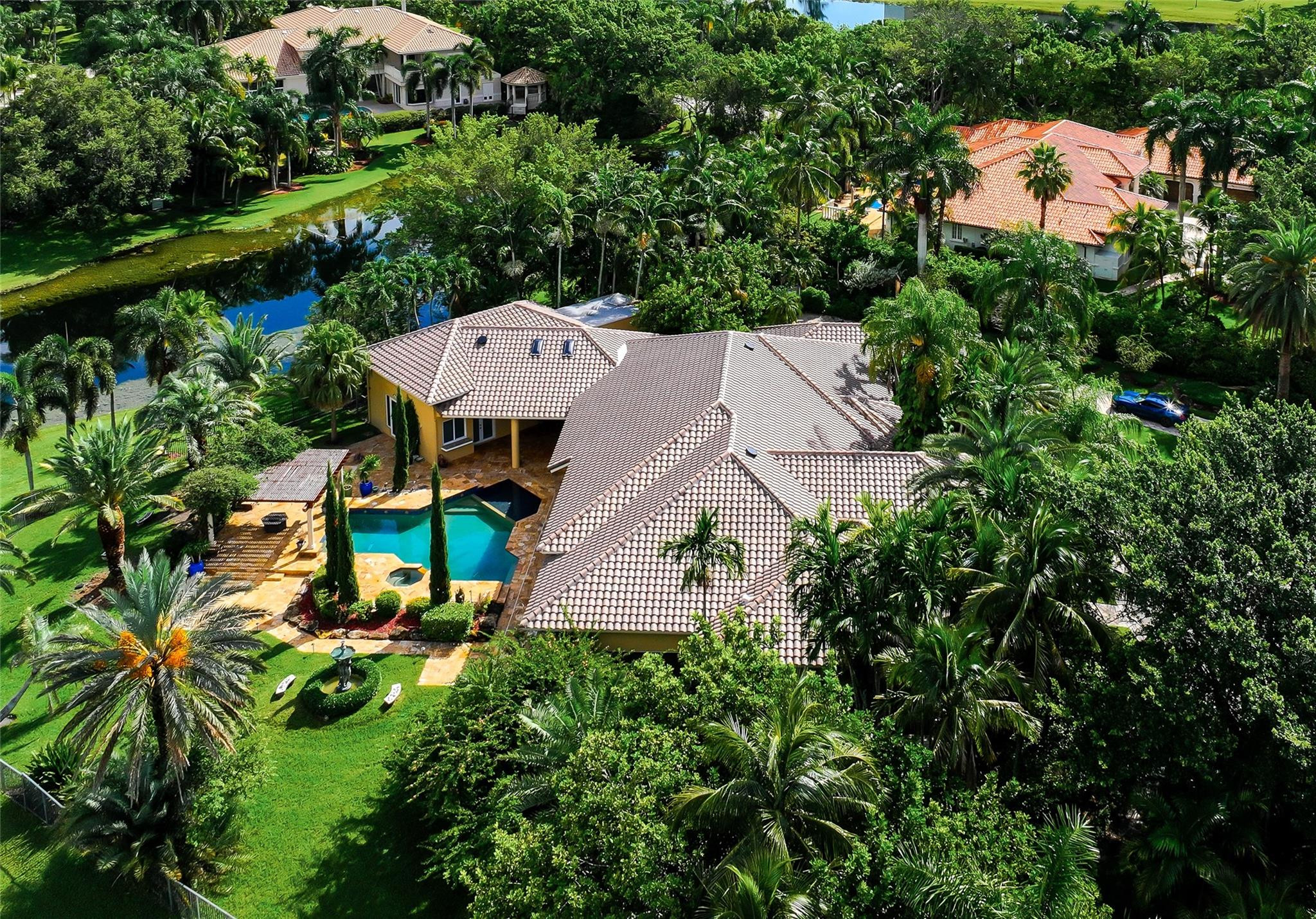 3220 Paddock Road Weston, FL 33331 - Photo 2 of 59 an aerial view of a house with yard swimming pool and outdoor seating