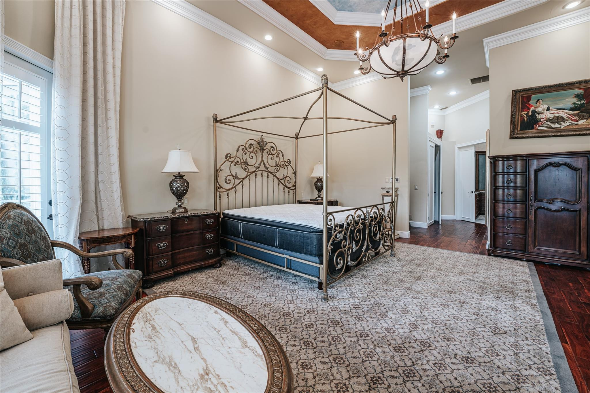 3220 Paddock Road Weston, FL 33331 - Photo 23 of 59 a bedroom with a bed a chandelier and dresser