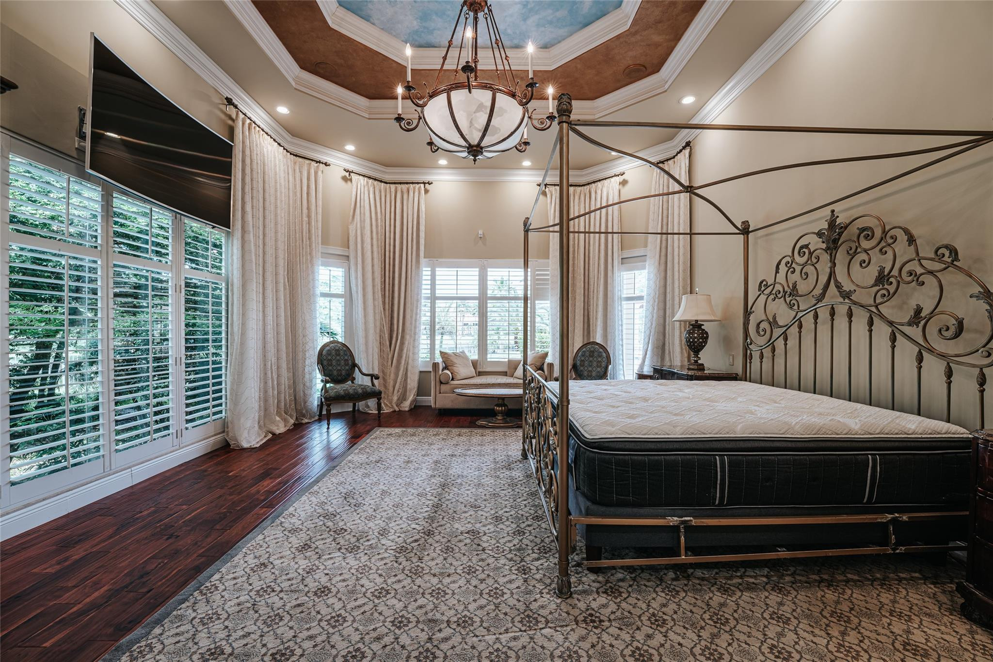 3220 Paddock Road Weston, FL 33331 - Photo 24 of 59 a bedroom with a bed and large windows