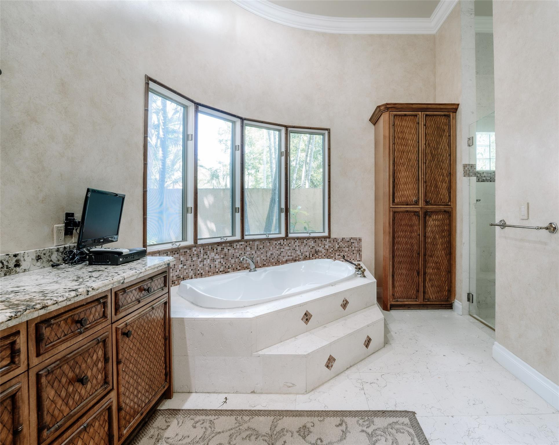 3220 Paddock Road Weston, FL 33331 - Photo 26 of 59 a spacious bathroom with a tub double sink and mirror