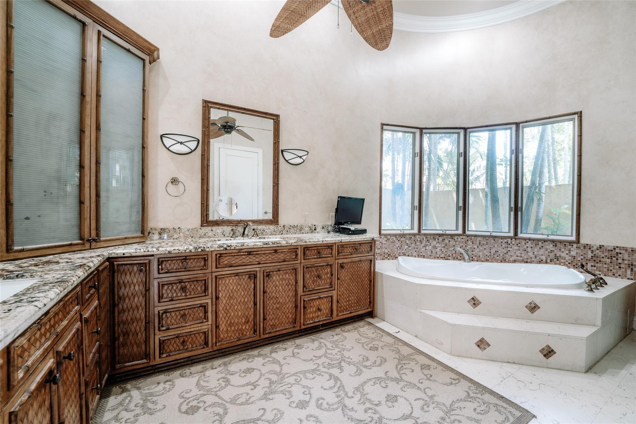 3220 Paddock Road Weston, FL 33331 - Photo 27 of 59 a bathroom with a tub sink and mirror