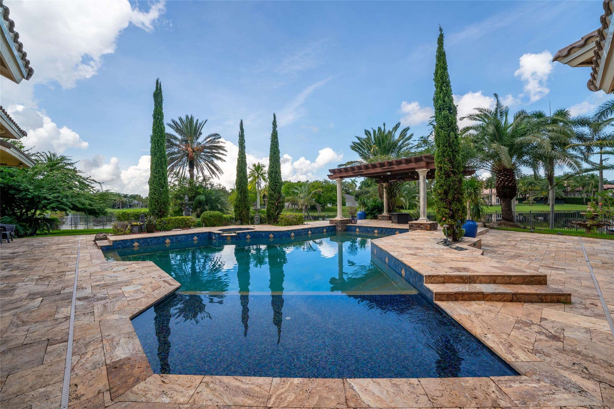 3220 Paddock Road Weston, FL 33331 - Photo 30 of 59 a view of swimming pool with a patio