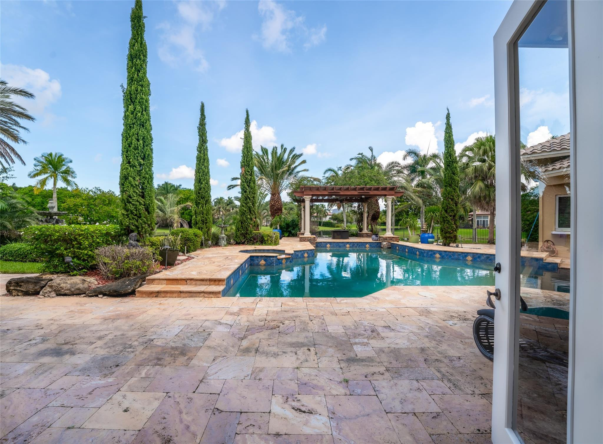 3220 Paddock Road Weston, FL 33331 - Photo 36 of 59 a view of swimming pool with a yard