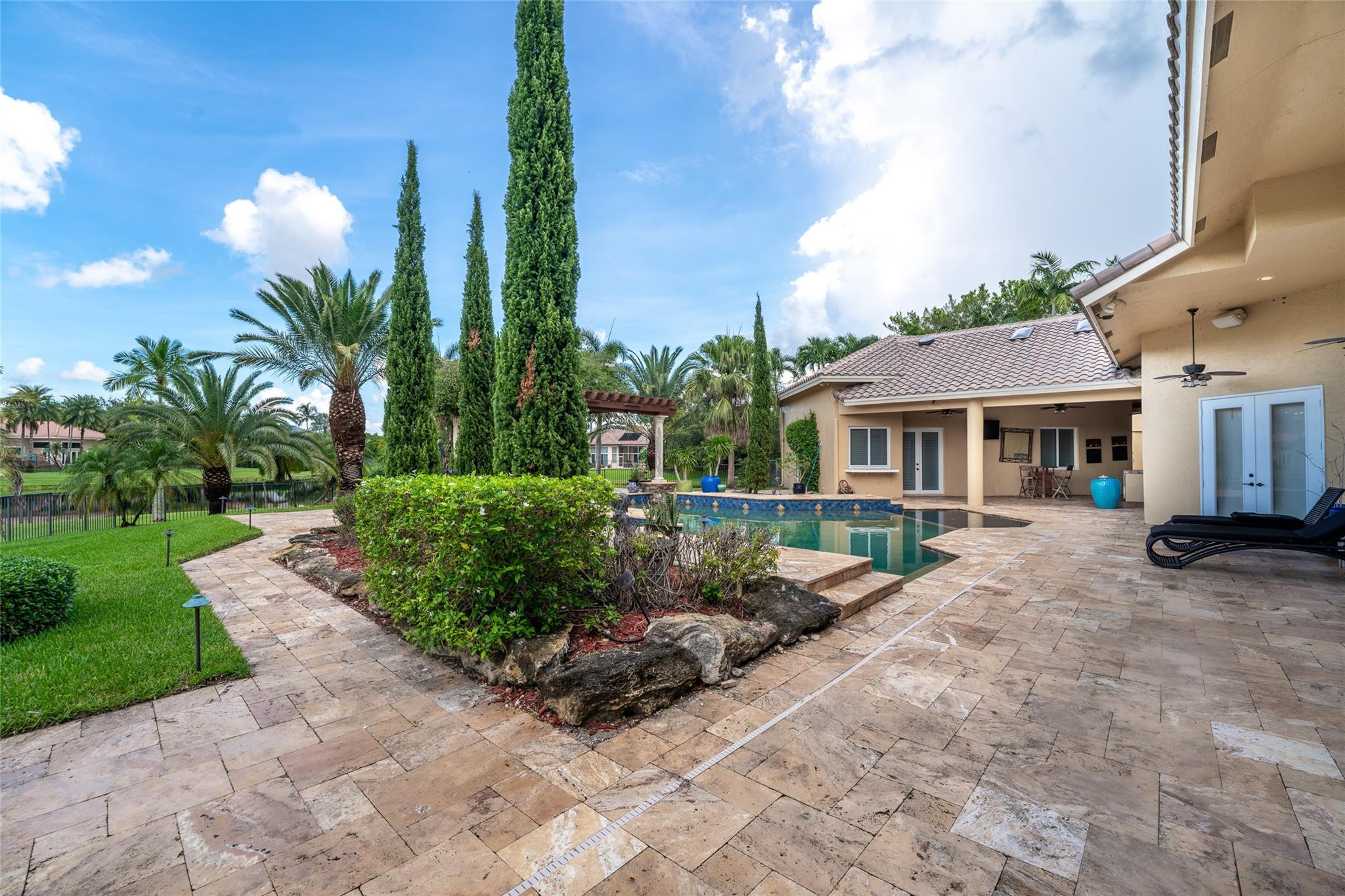 3220 Paddock Road Weston, FL 33331 - Photo 37 of 59 a view of a house with backyard