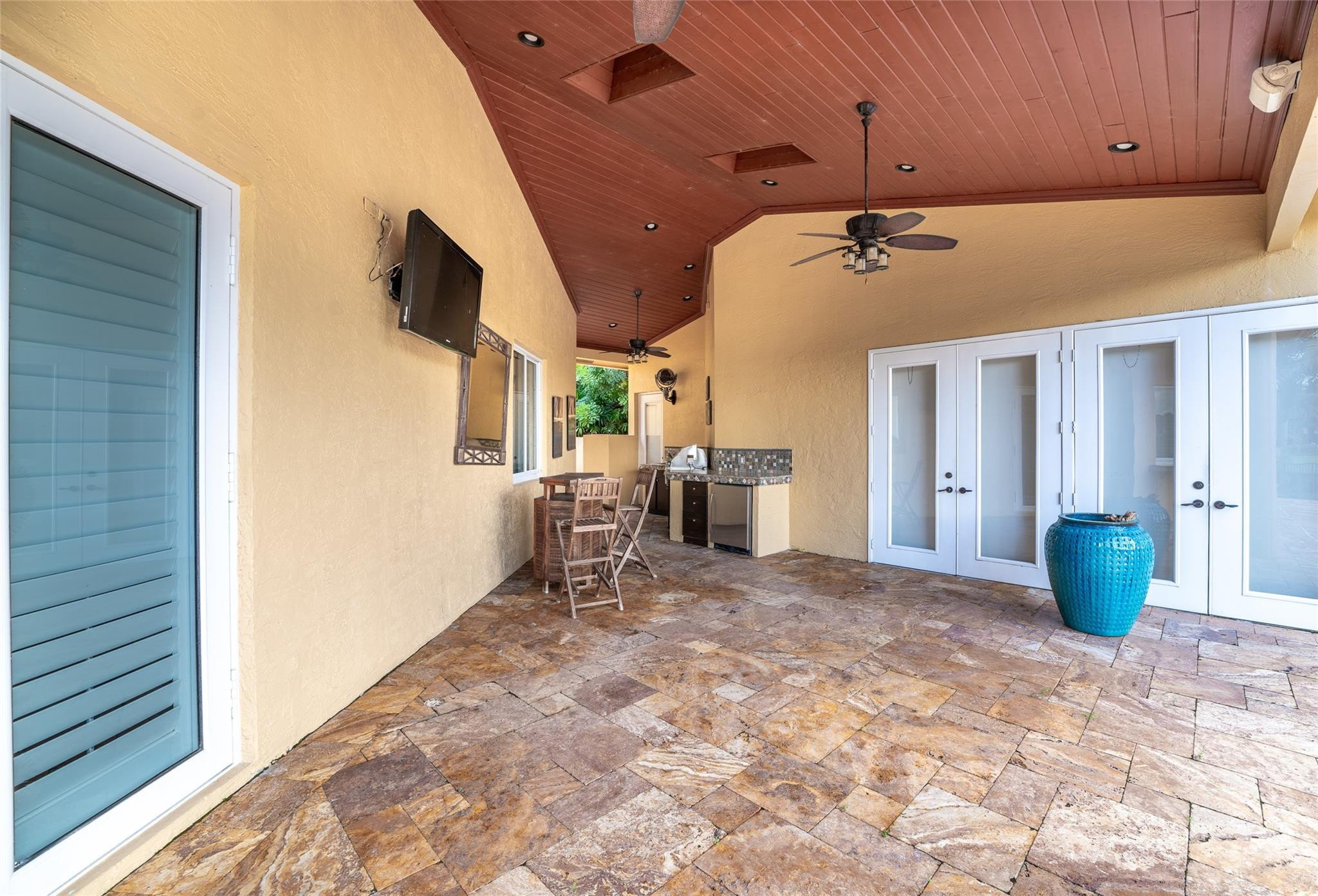 3220 Paddock Road Weston, FL 33331 - Photo 39 of 59 a view of a livingroom with a chair and potted plant
