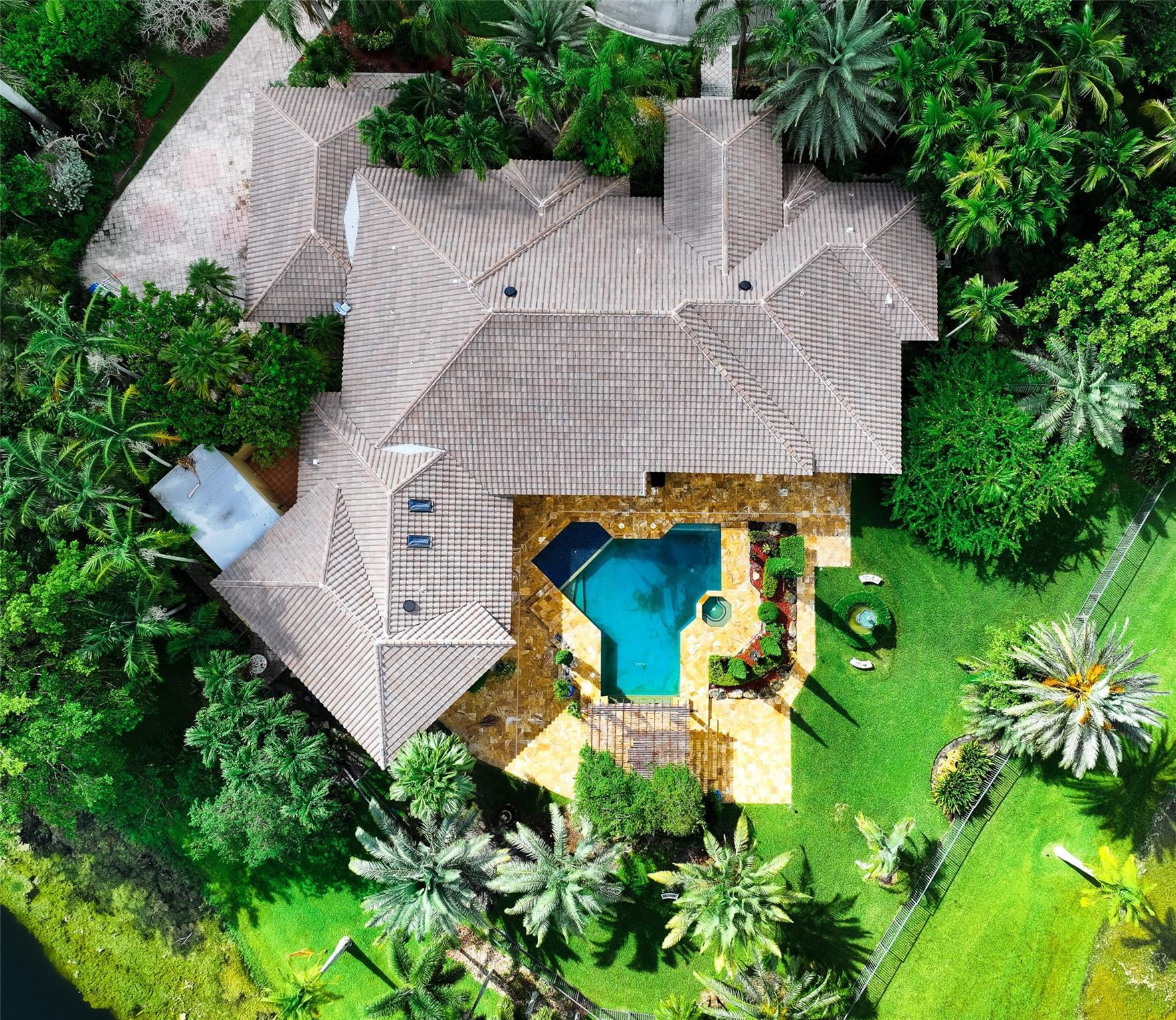 3220 Paddock Road Weston, FL 33331 - Photo 44 of 59 an aerial view of a house with yard and swimming pool