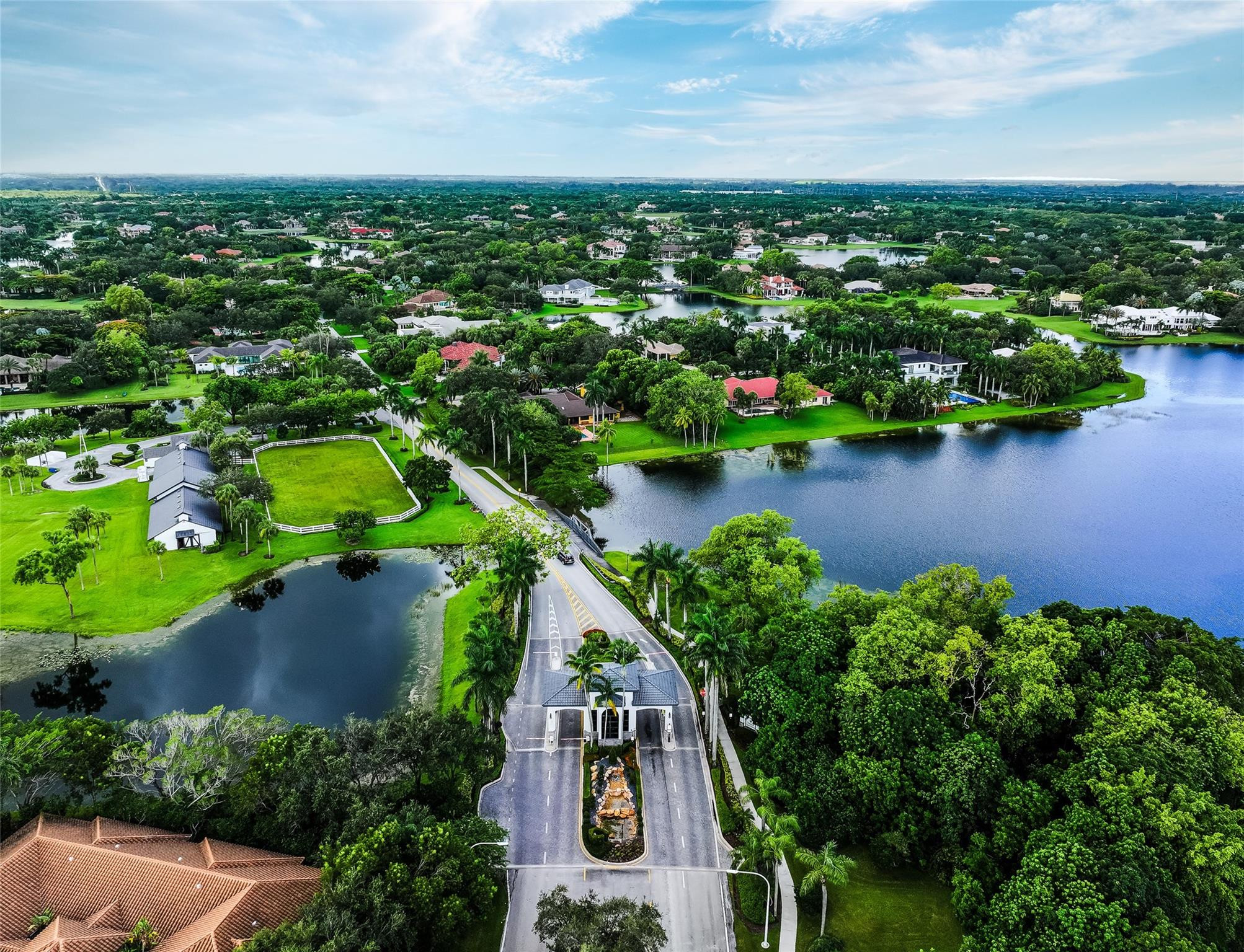 3220 Paddock Road Weston, FL 33331 - Photo 50 of 59 an aerial view of a house with a yard and lake view