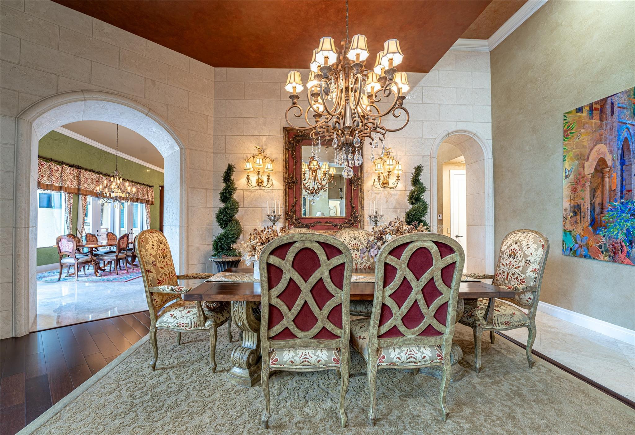 3220 Paddock Road Weston, FL 33331 - Photo 8 of 59 a dining room with wooden floor a chandelier a wooden table and chairs