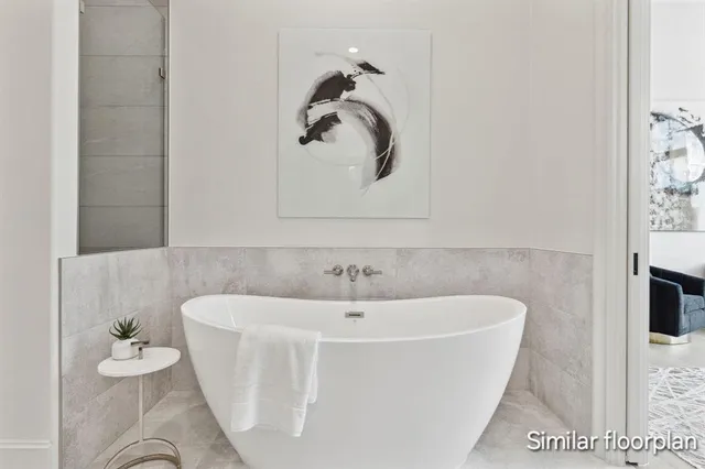 a white bath tub sitting in a bathroom