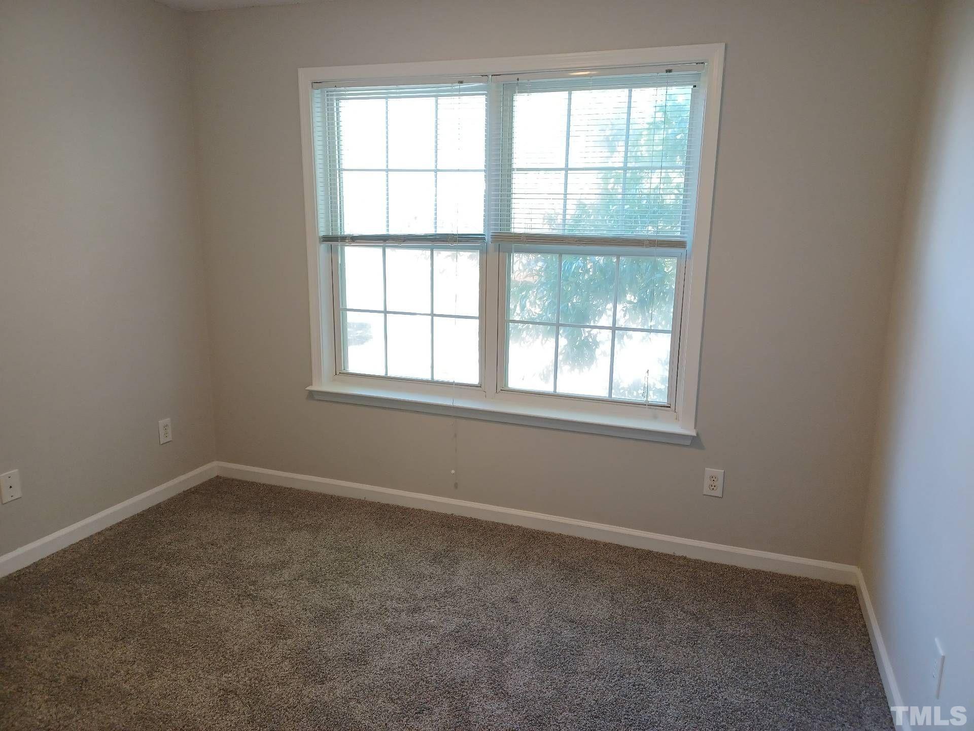 208 Lindell Drive Apex, NC 27539 - Photo 14 of 27 an empty room with a window