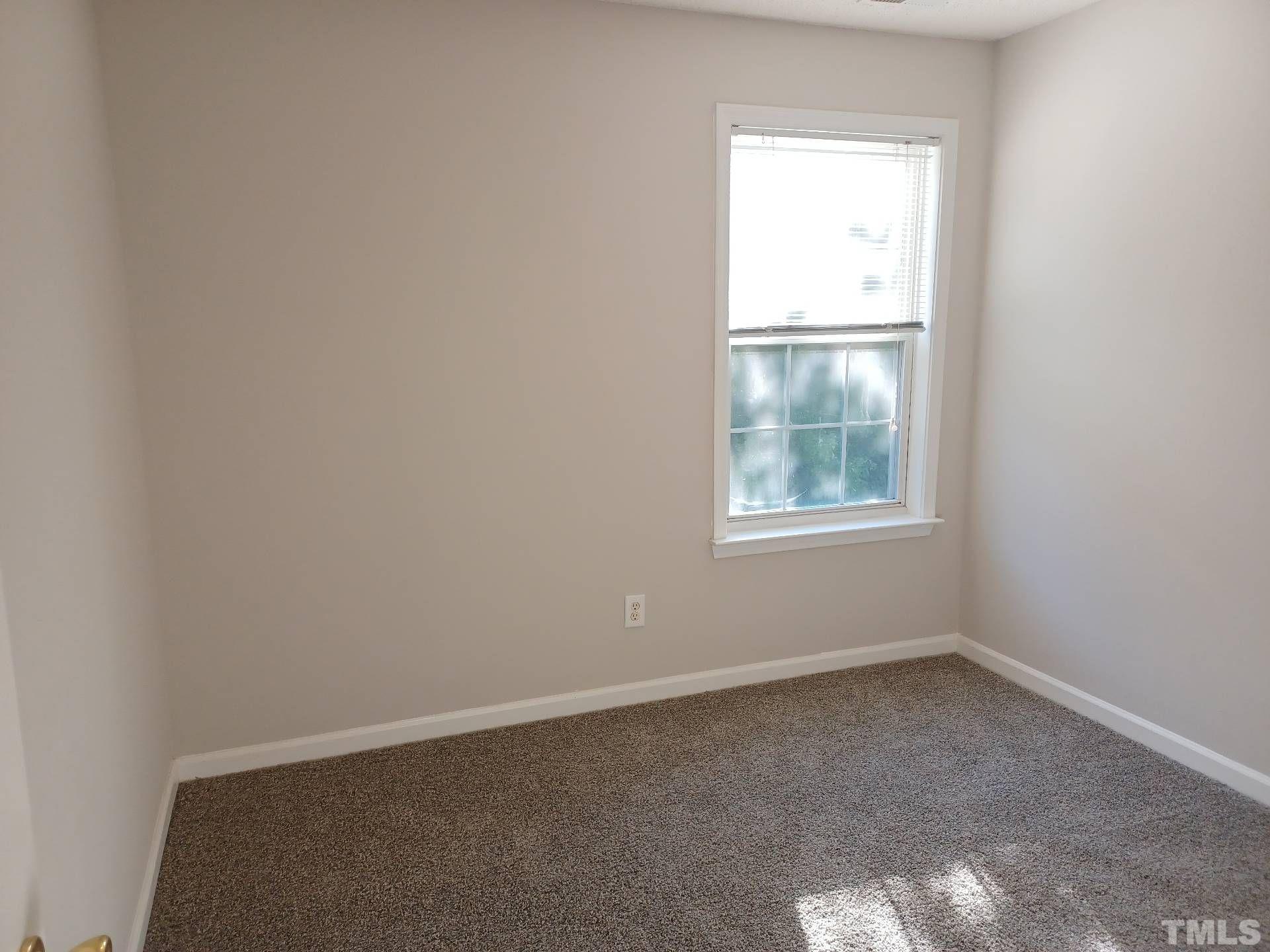 208 Lindell Drive Apex, NC 27539 - Photo 16 of 27 an empty room with a window