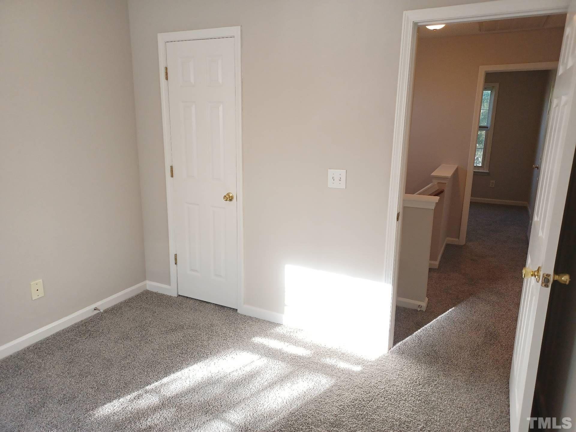 208 Lindell Drive Apex, NC 27539 - Photo 17 of 27 a view of a hallway with a room