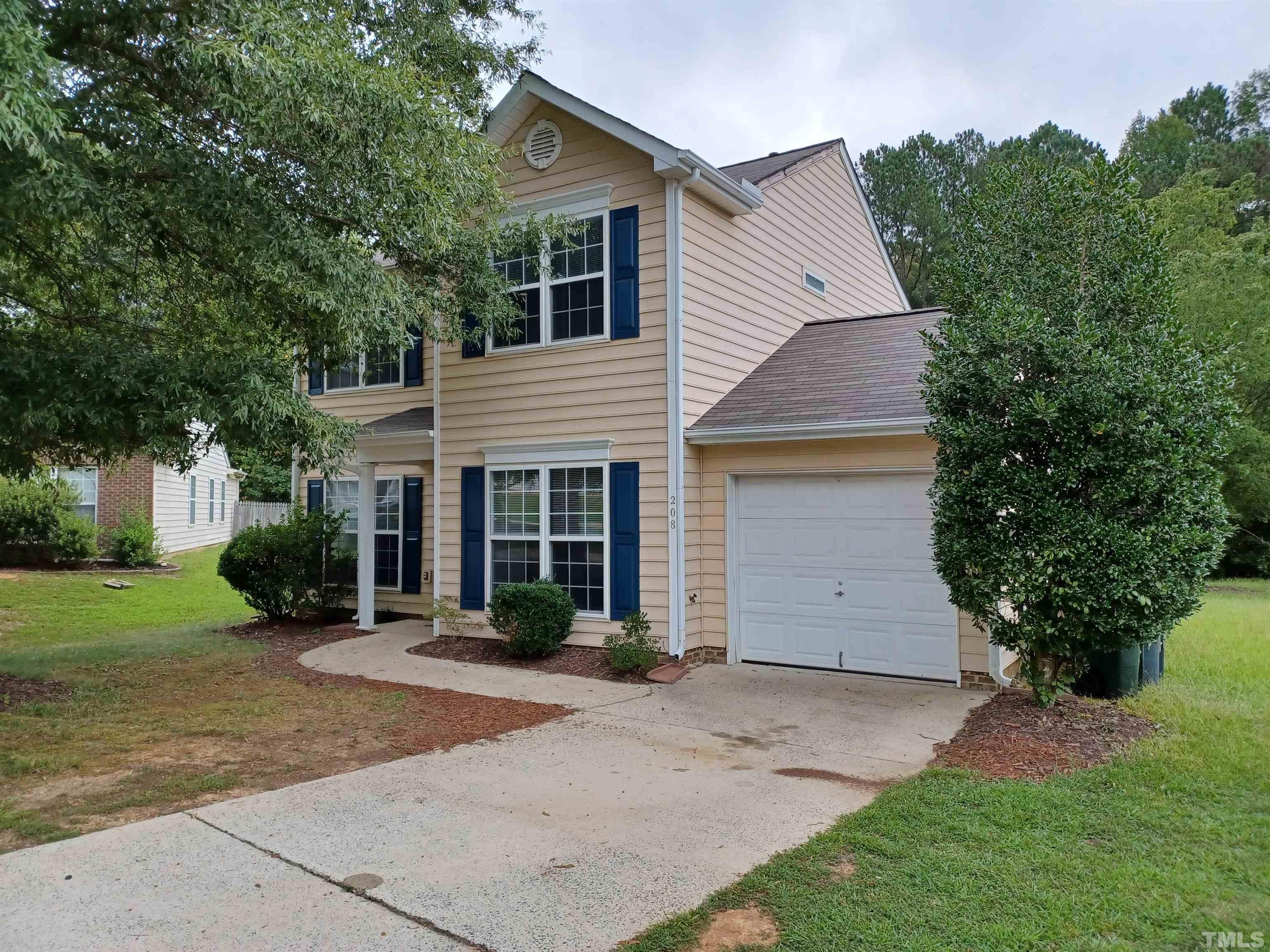 208 Lindell Drive Apex, NC 27539 - Photo 2 of 27 front view of a house with a yard