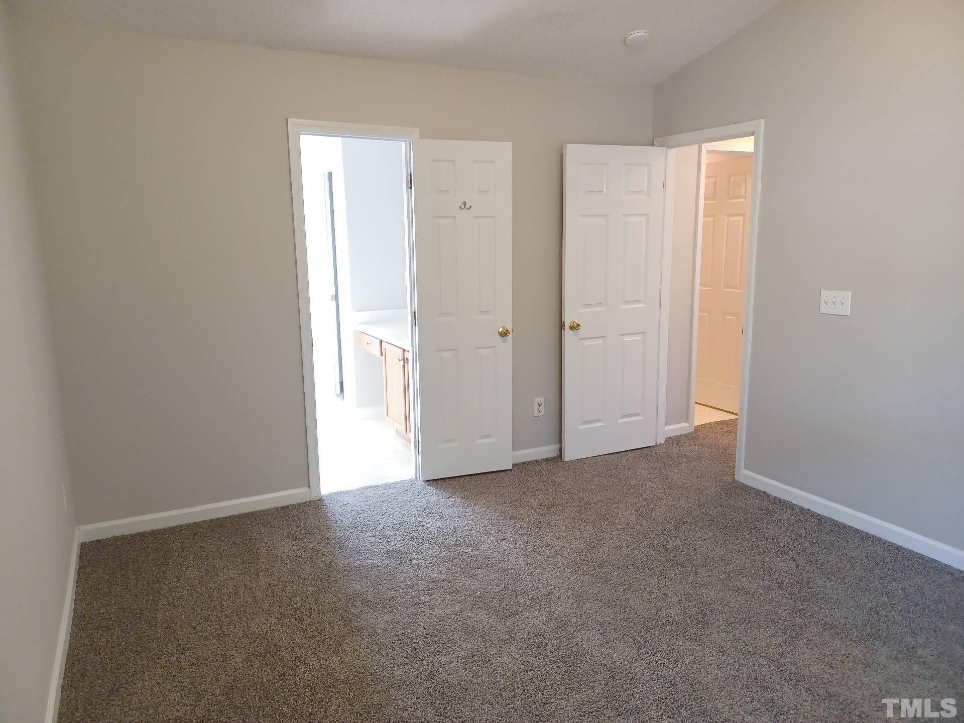 208 Lindell Drive Apex, NC 27539 - Photo 21 of 27 a view of an empty room and closet area