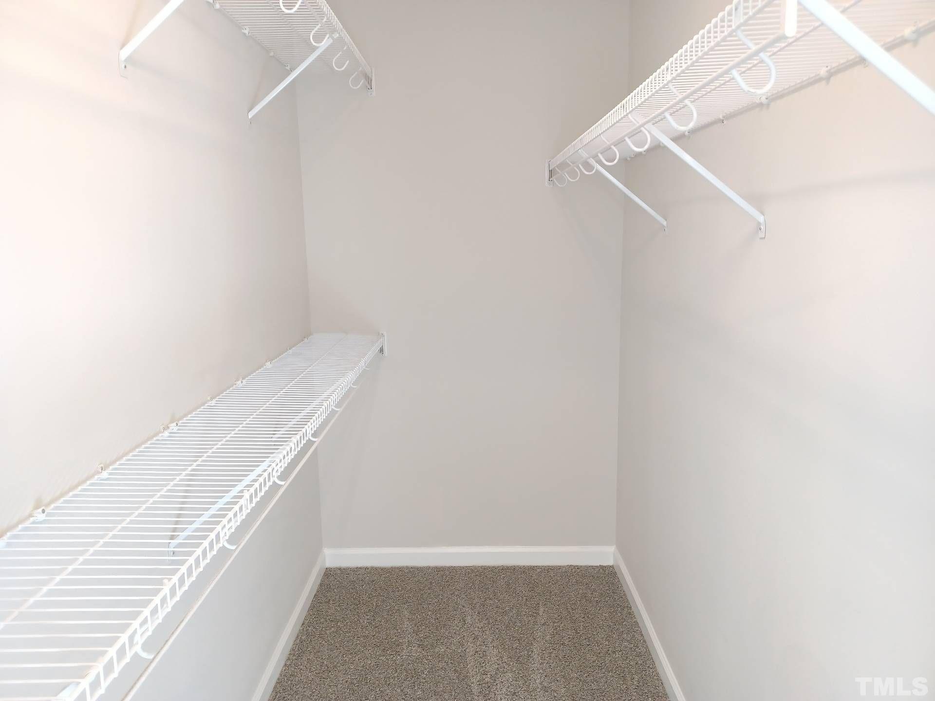 208 Lindell Drive Apex, NC 27539 - Photo 24 of 27 a view of an empty walk in closet