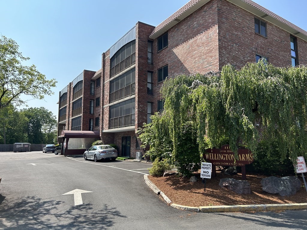 a car parked in front of a brick building