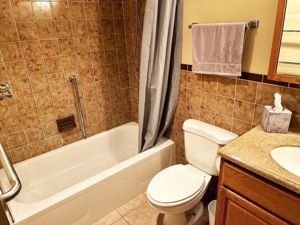 111 Devir Street, Unit 402 Malden, MA 02148 - Photo 12 of 19 a bathroom with a sink and a toilet