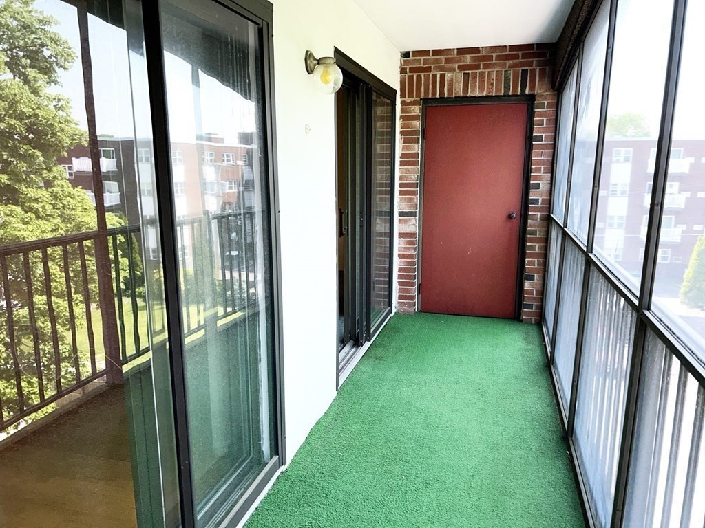111 Devir Street, Unit 402 Malden, MA 02148 - Photo 15 of 19 a view of porch with a floor to ceiling window