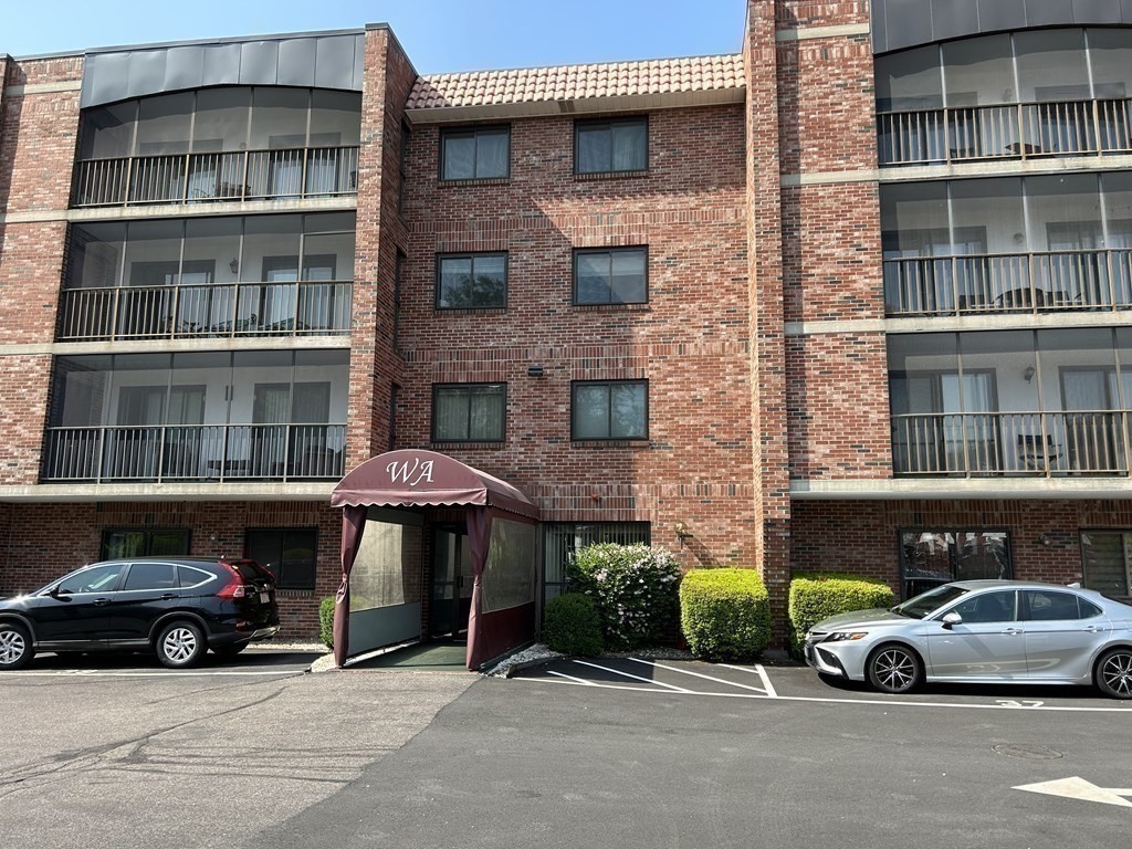 111 Devir Street, Unit 402 Malden, MA 02148 - Photo 2 of 19 a car parked in front of a building