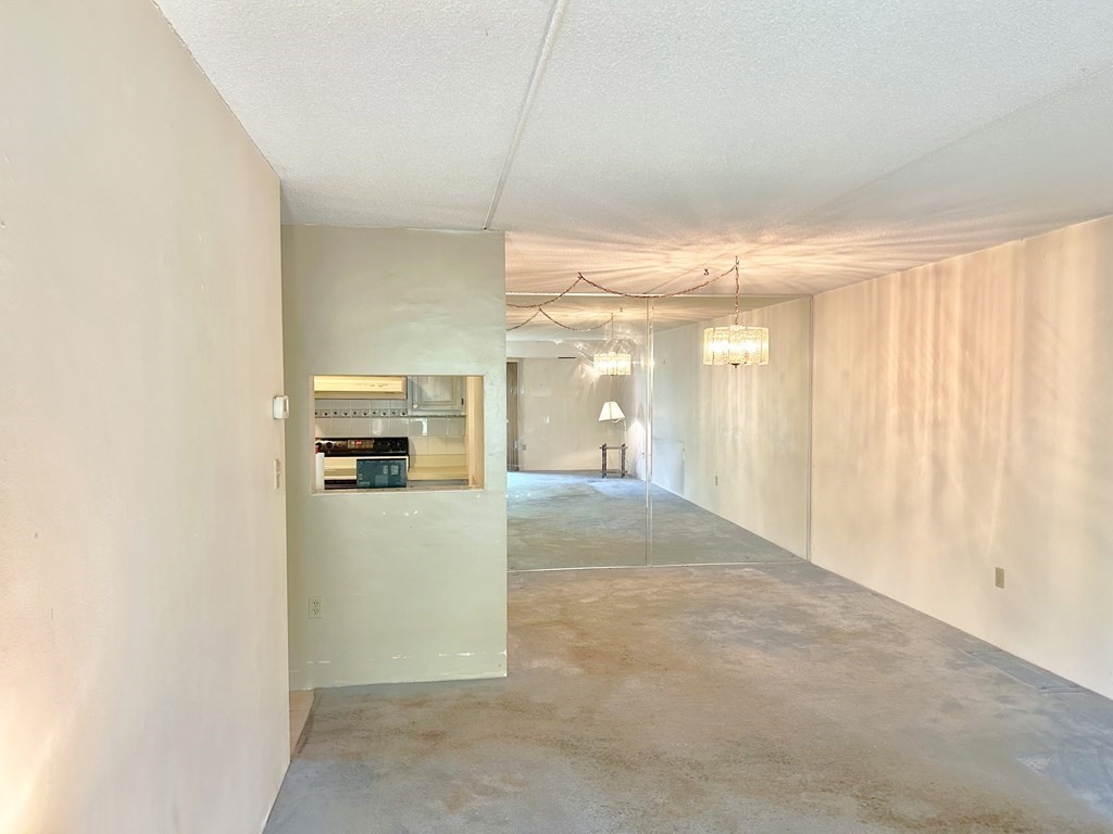111 Devir Street, Unit 402 Malden, MA 02148 - Photo 4 of 19 a view of a hallway to a bedroom