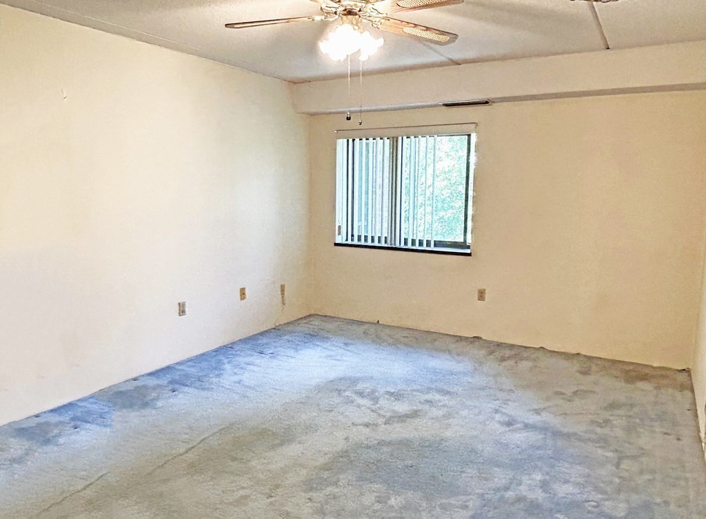 111 Devir Street, Unit 402 Malden, MA 02148 - Photo 7 of 19 an empty room with windows and fan
