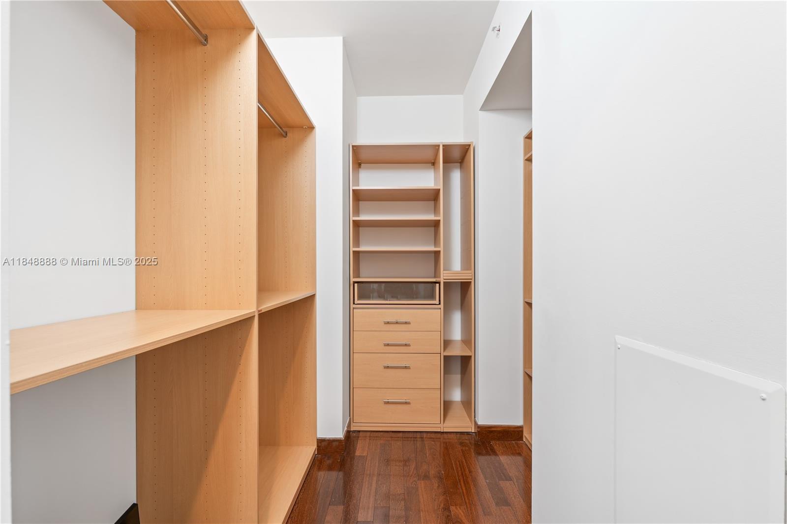 1331 Brickell Bay Drive, Unit 208 Miami, FL 33131 - Photo 13 of 29 a view of walk in closet with empty racks