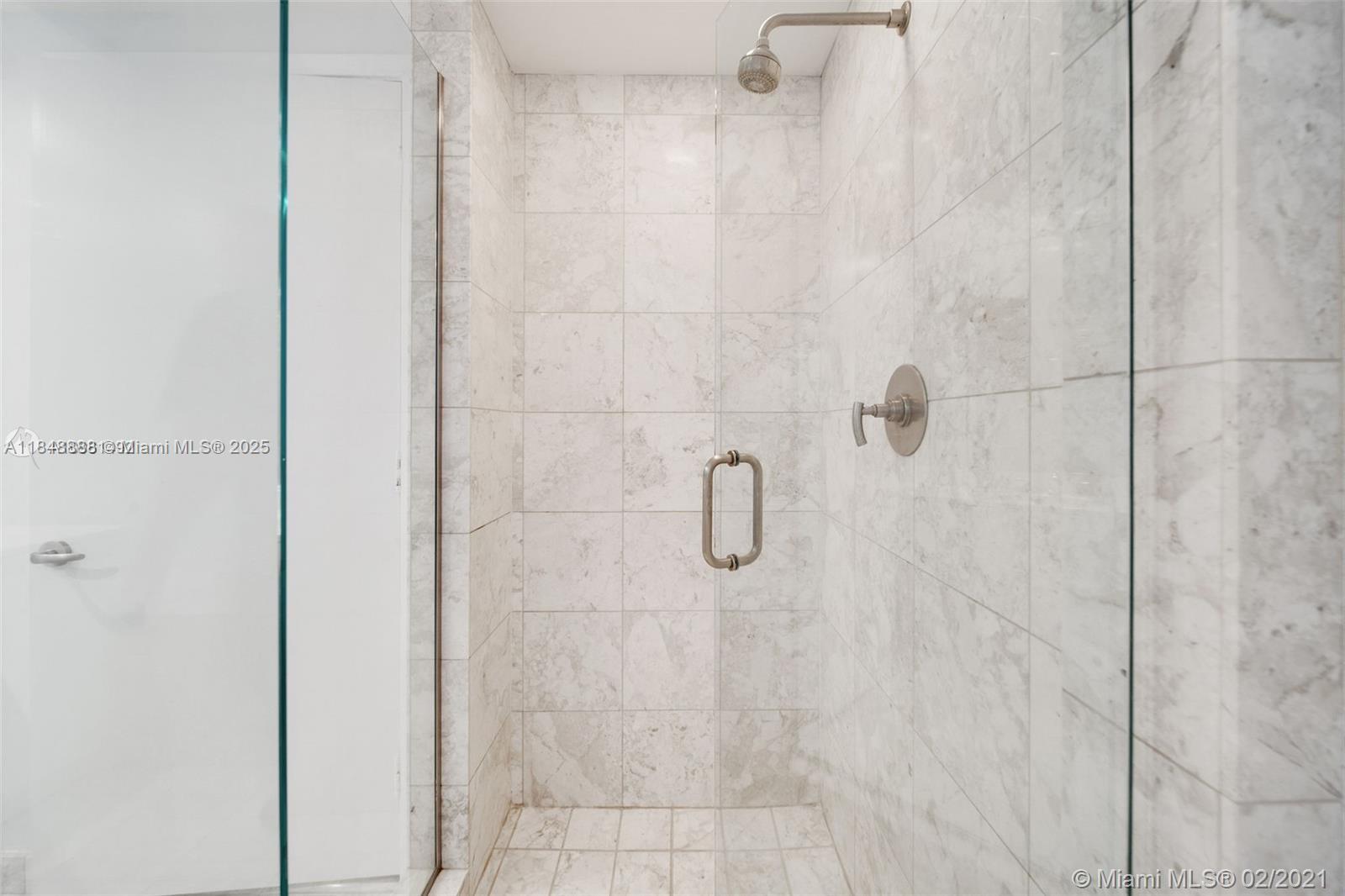 1331 Brickell Bay Drive, Unit 208 Miami, FL 33131 - Photo 15 of 29 a bathroom with a shower