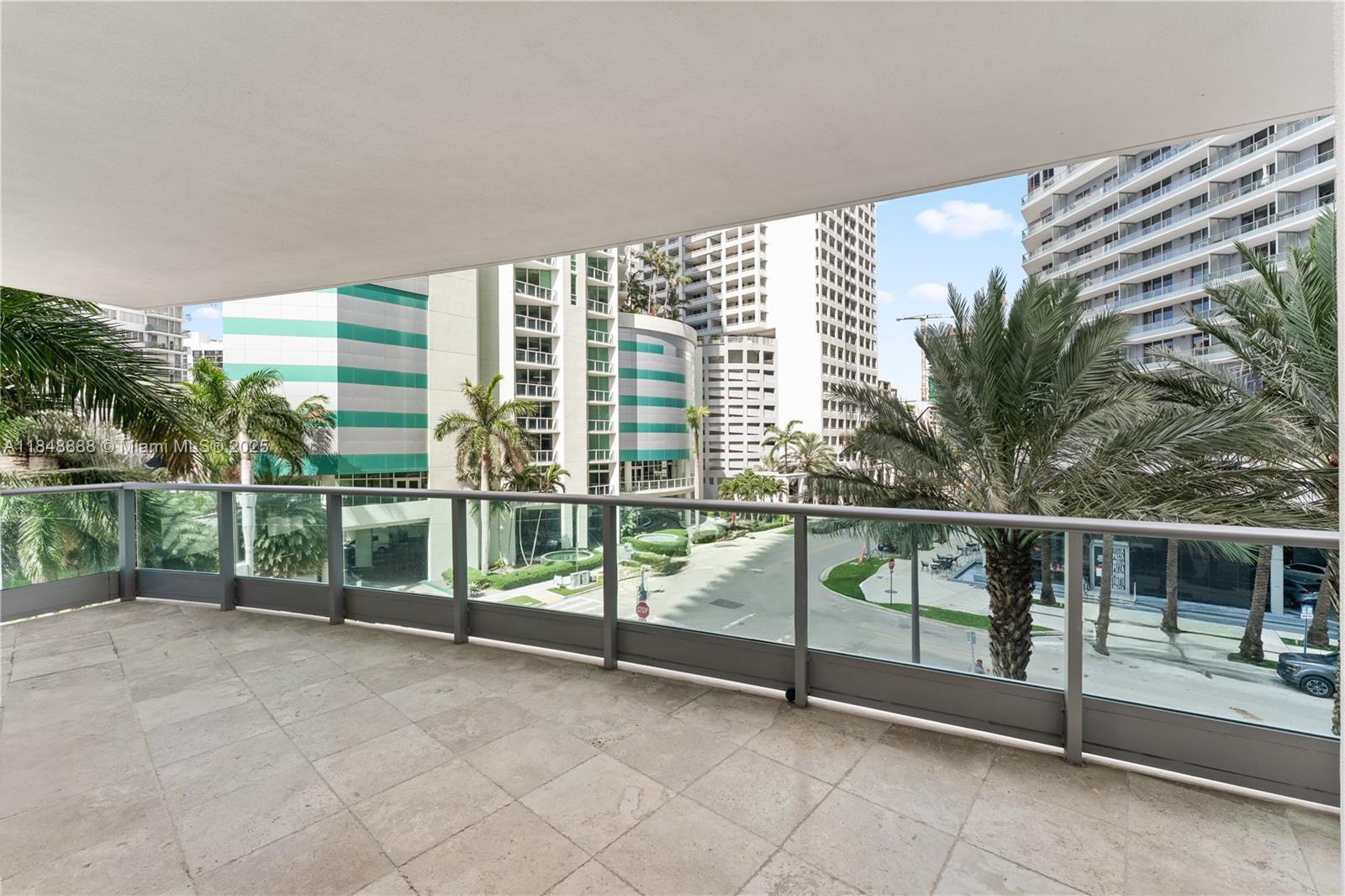 1331 Brickell Bay Drive, Unit 208 Miami, FL 33131 - Photo 23 of 29 a view of a balcony with floor to ceiling windows