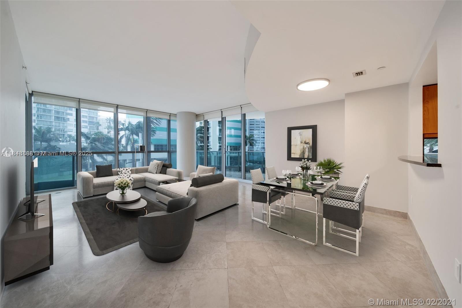 1331 Brickell Bay Drive, Unit 208 Miami, FL 33131 - Photo 3 of 29 a living room with furniture and a floor to ceiling window