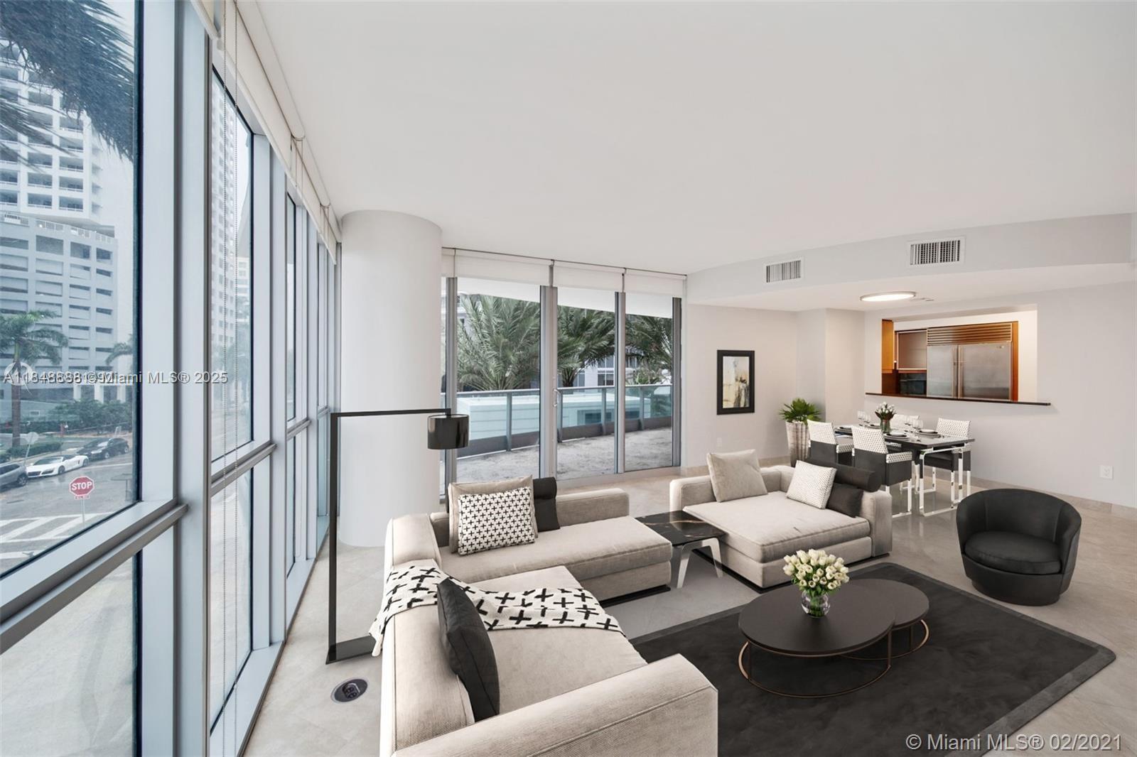 1331 Brickell Bay Drive, Unit 208 Miami, FL 33131 - Photo 4 of 29 a living room with furniture and a floor to ceiling window