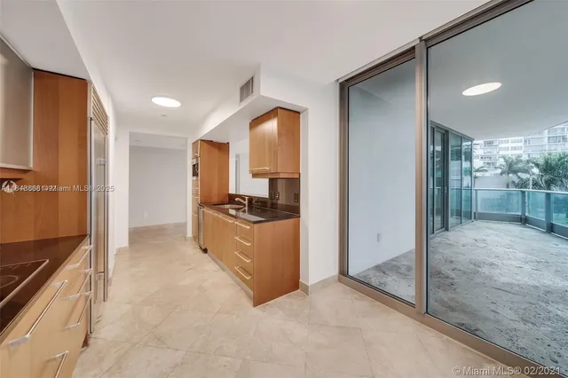 a large bathroom with a glass door shower and a sink