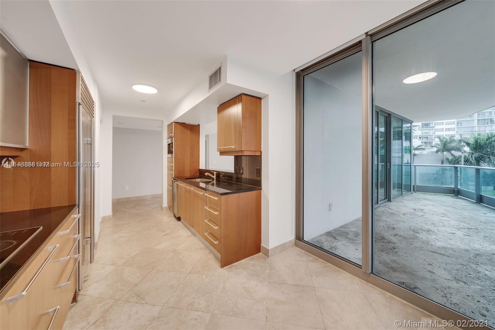 1331 Brickell Bay Drive, Unit 208 Miami, FL 33131 - Photo 9 of 29 a large bathroom with a glass door shower and a sink