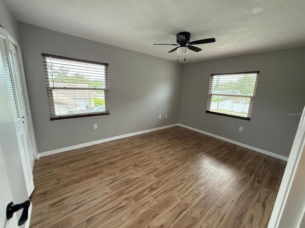 502 Oakhurst Street Brandon, FL 33511 - Photo 28 of 40 a view of an empty room with wooden floor and a window