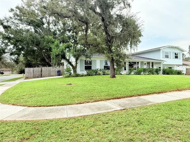 a view of house with a garden