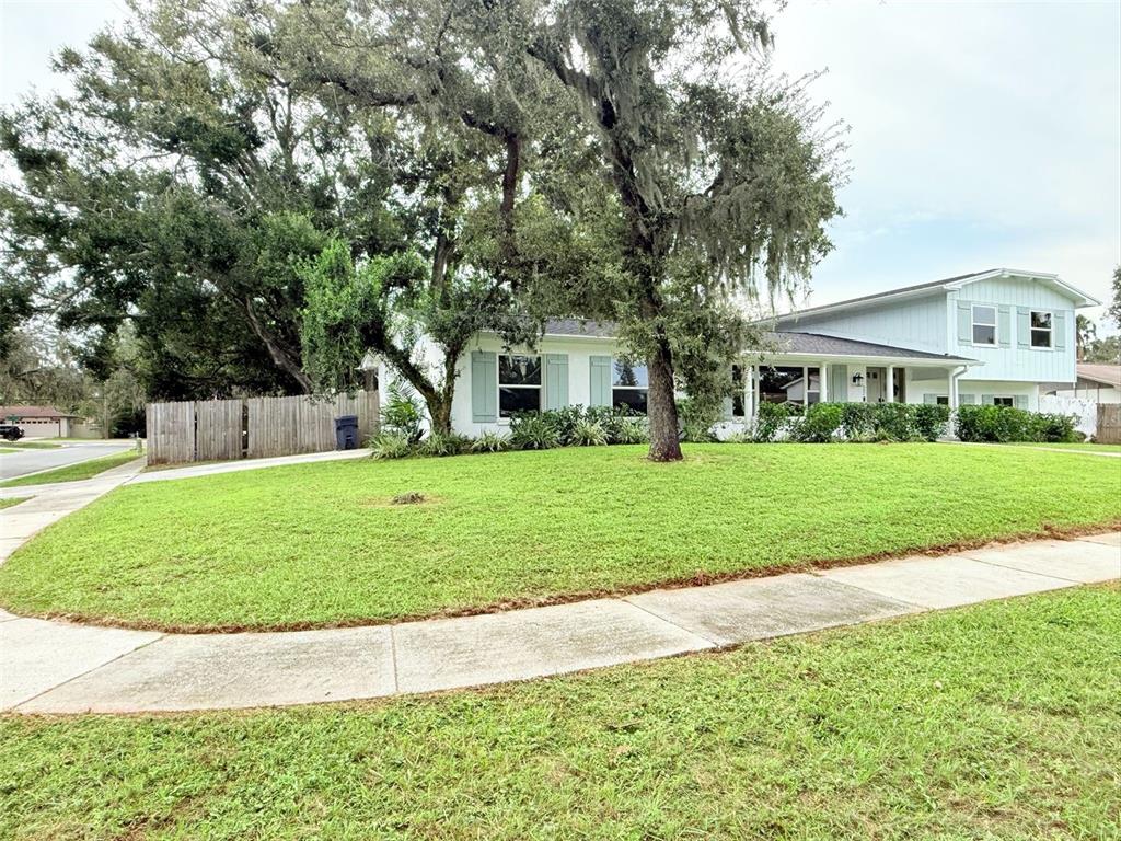 502 Oakhurst Street Brandon, FL 33511 - Photo 3 of 40 a view of house with a garden